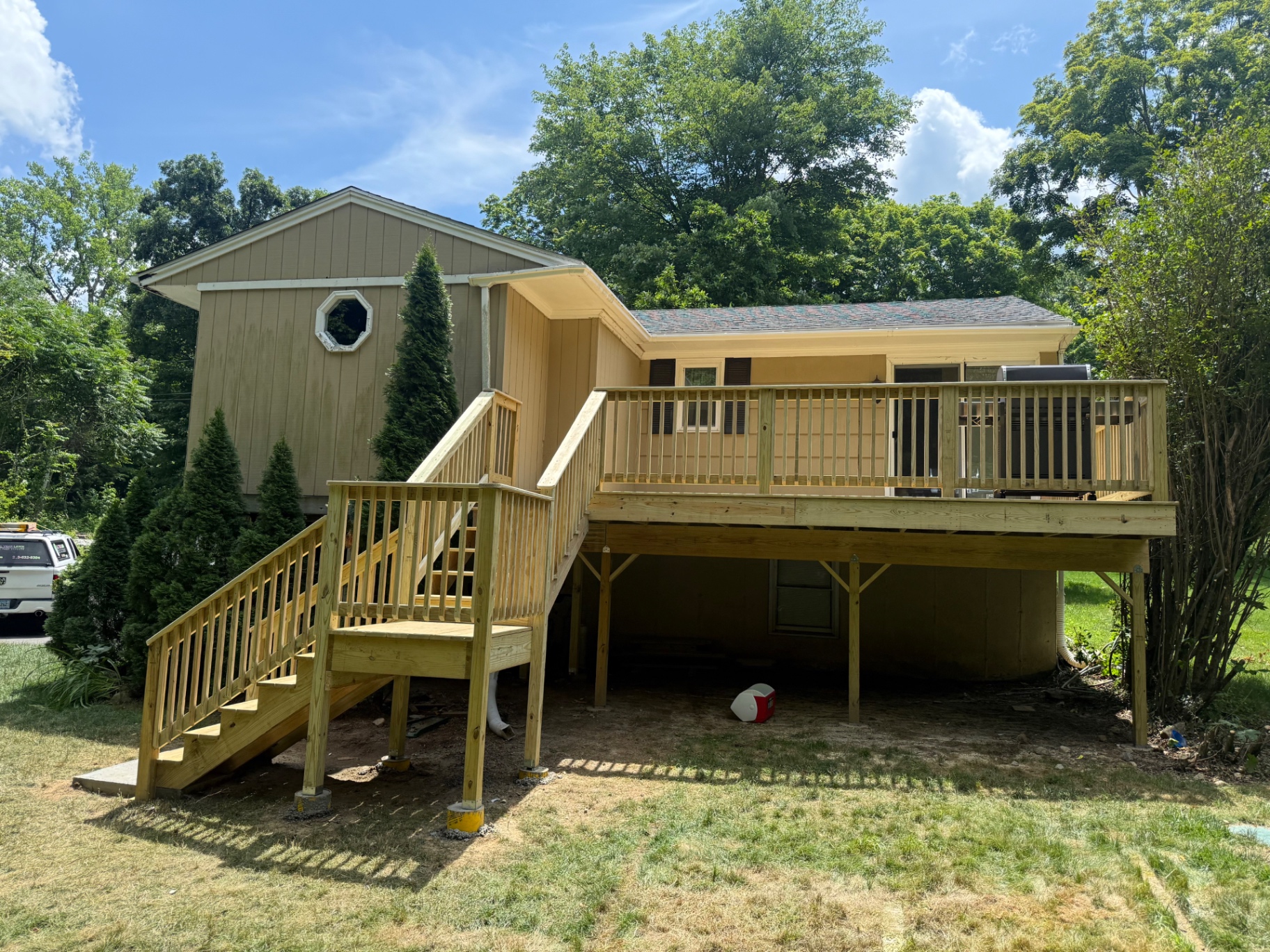 Finished elevated deck with railings and stair landing on a Prospect, CT home